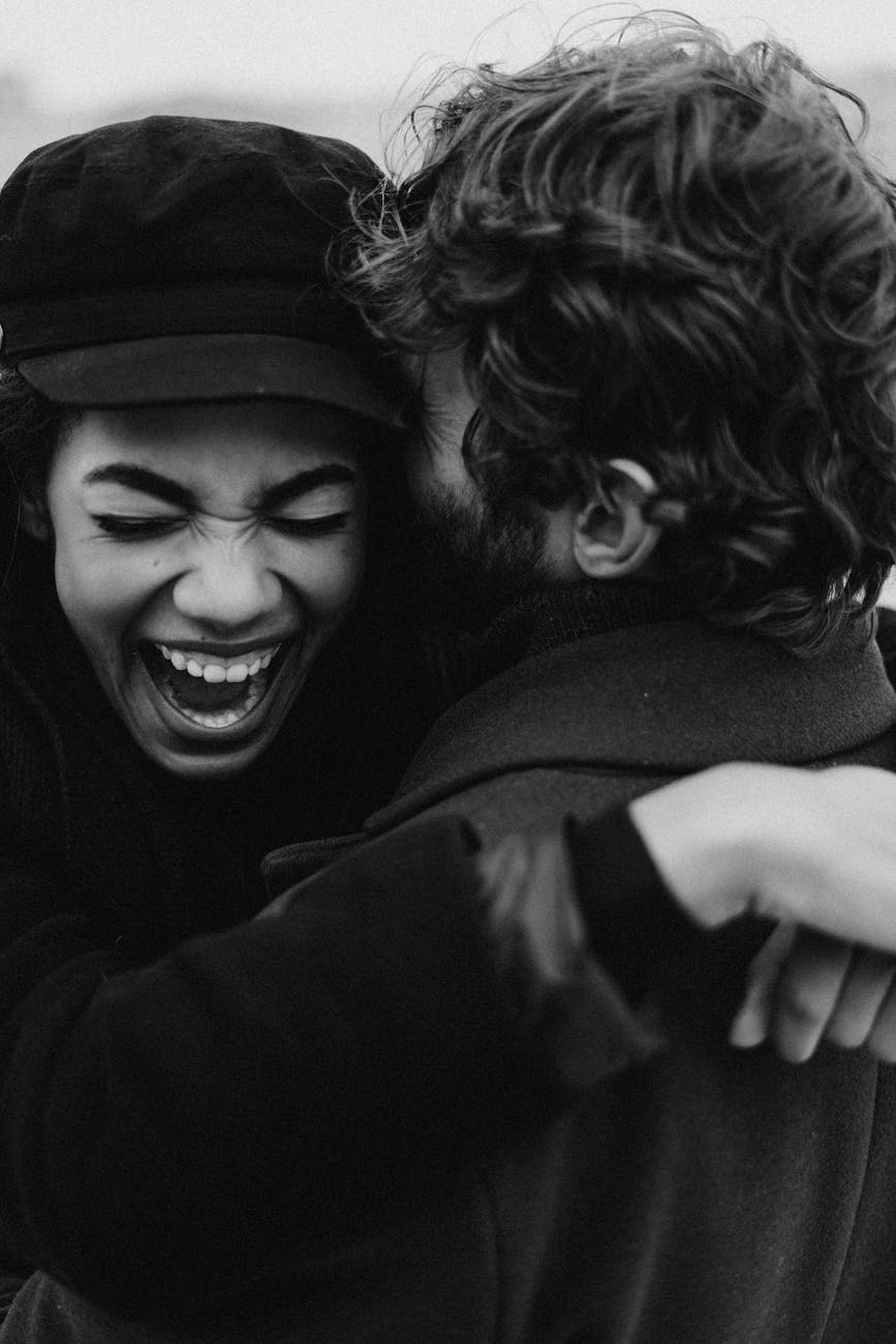 gray scale photo of smiling woman